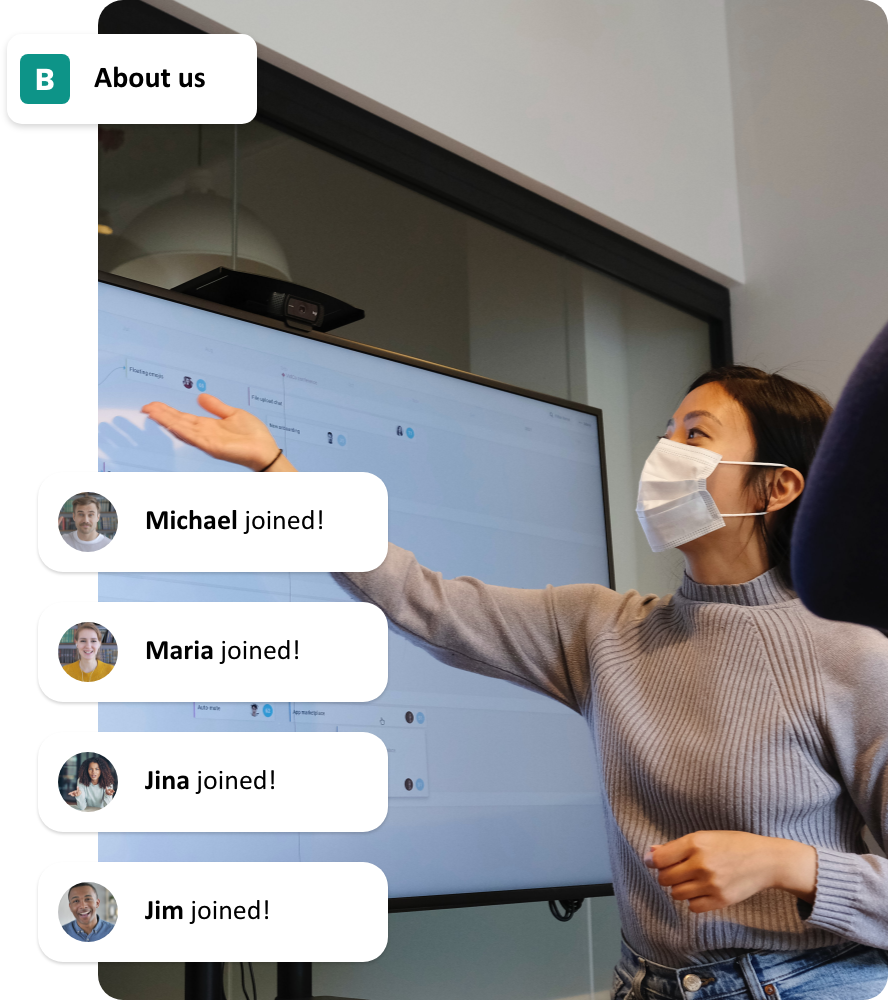 Whitney leaning against a railing on a downtown street